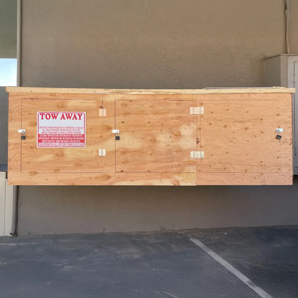 Restored outdoor plywood storage enclosure after wood rot damage, reinforced for structural stability and tenant safety.